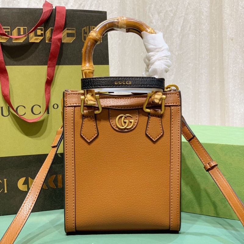 G*u*i top handle bags